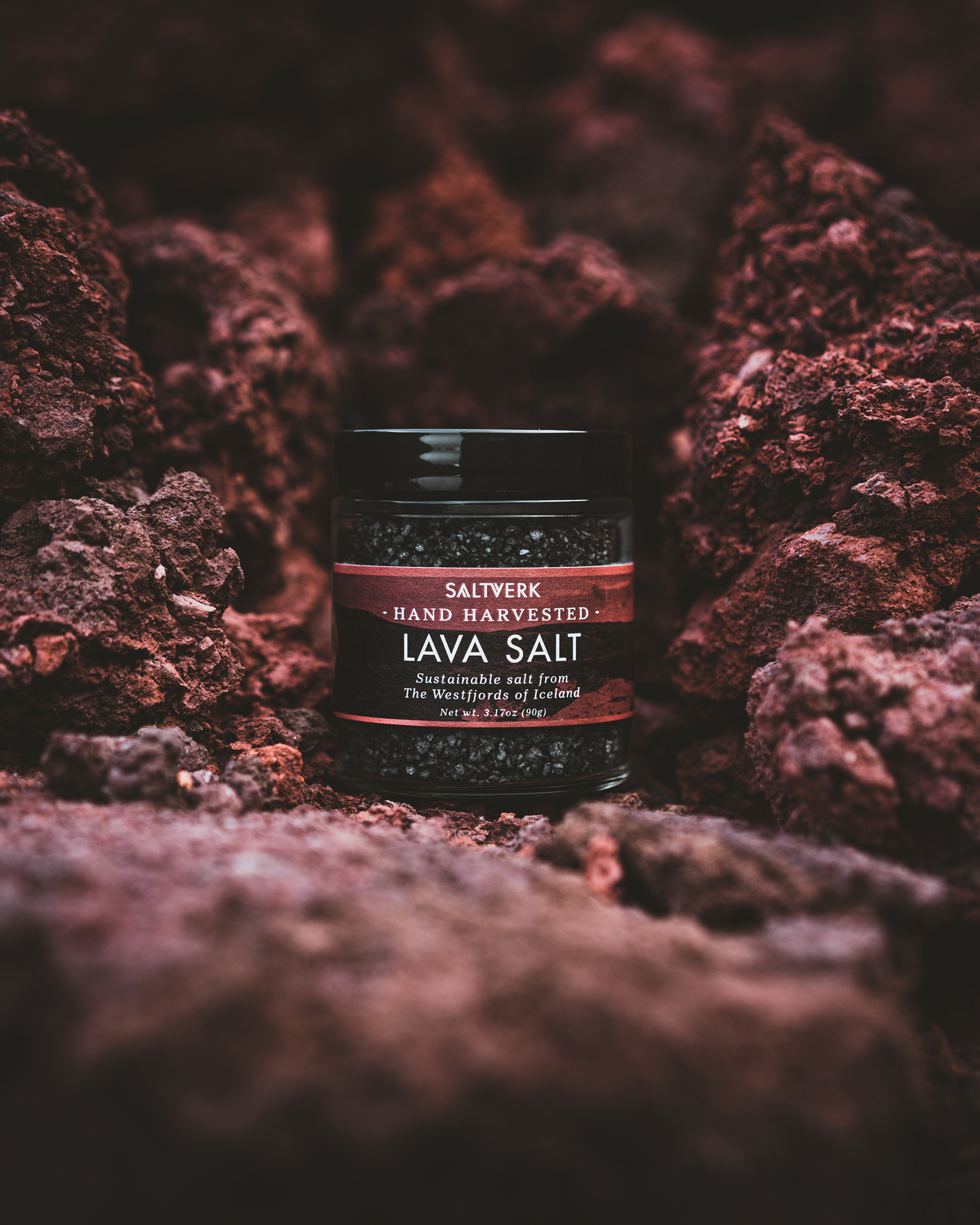 Jar of Saltywerk Lava Salt on a textured brown background