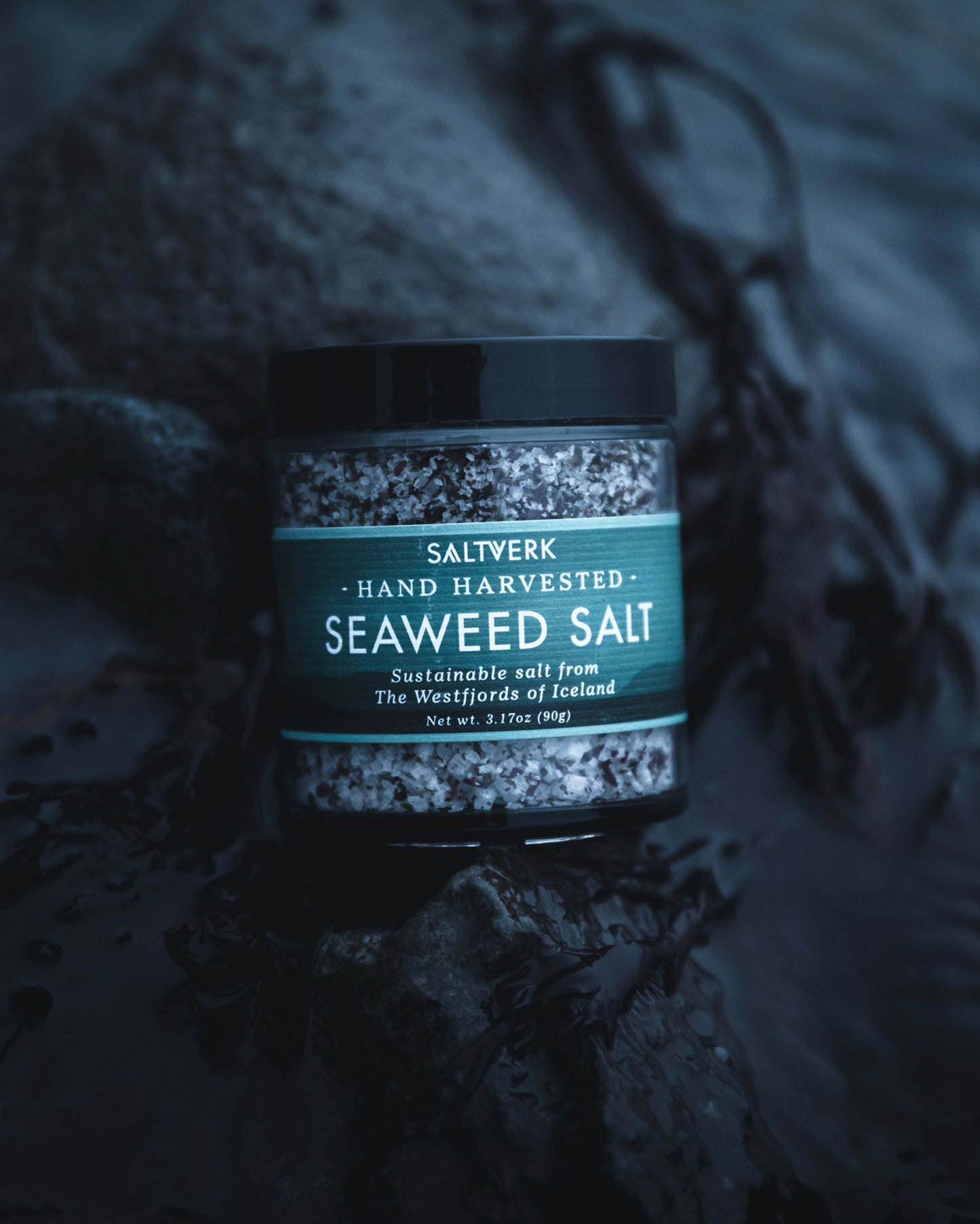 Jar of Saltverk Seaweed Salt on a rocky surface