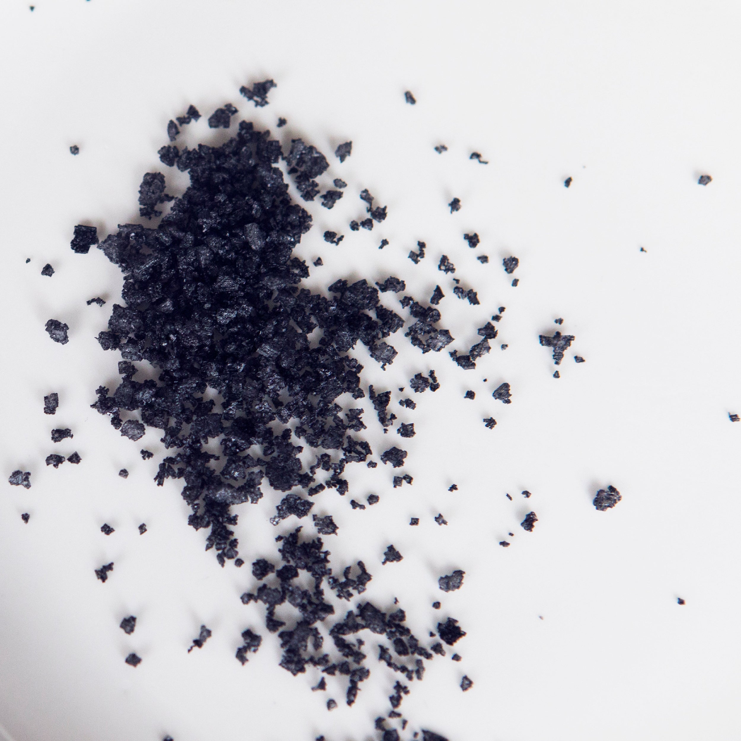 Black granules on a white background