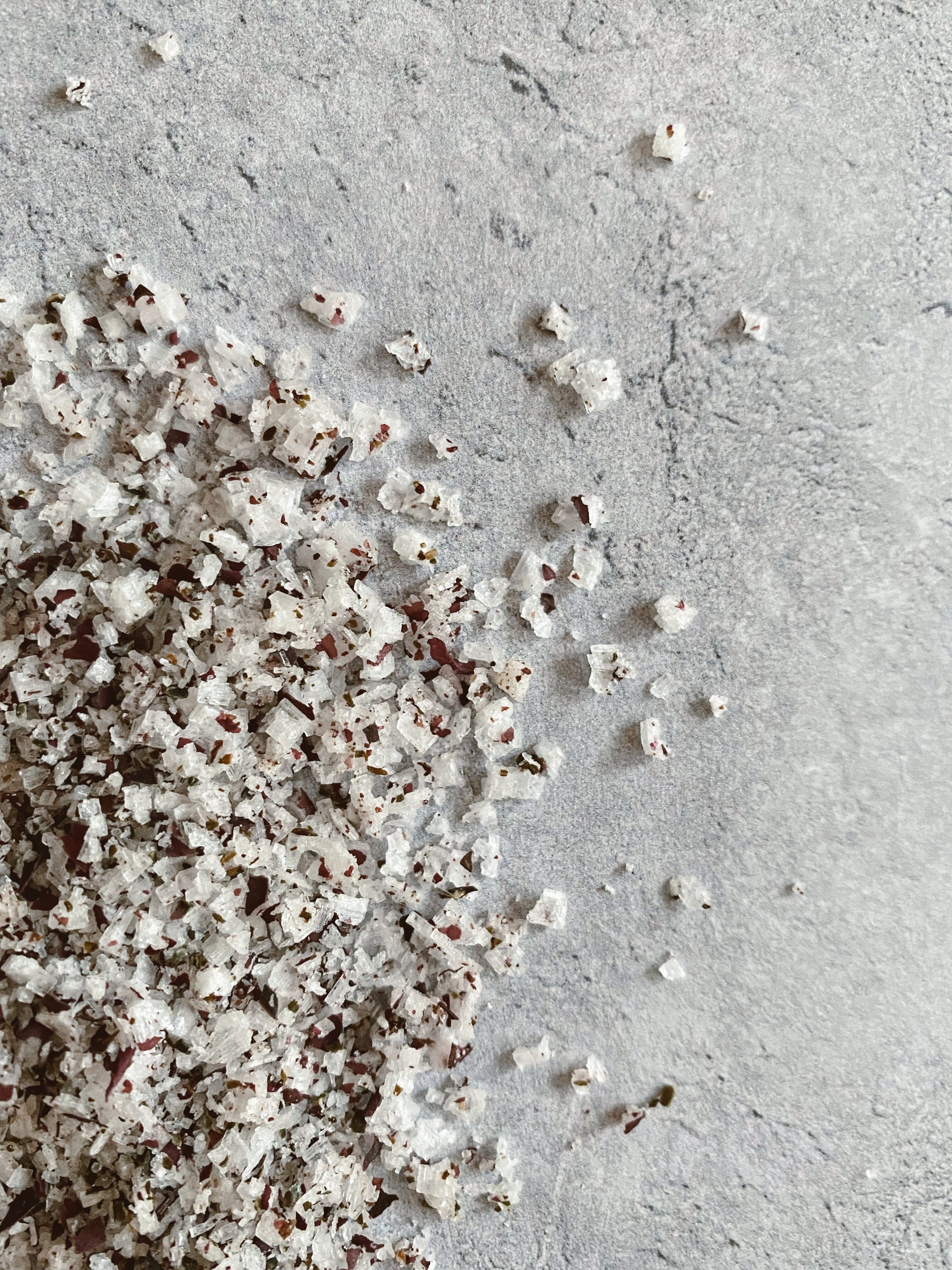 Close-up of ground pepper on a light gray surface